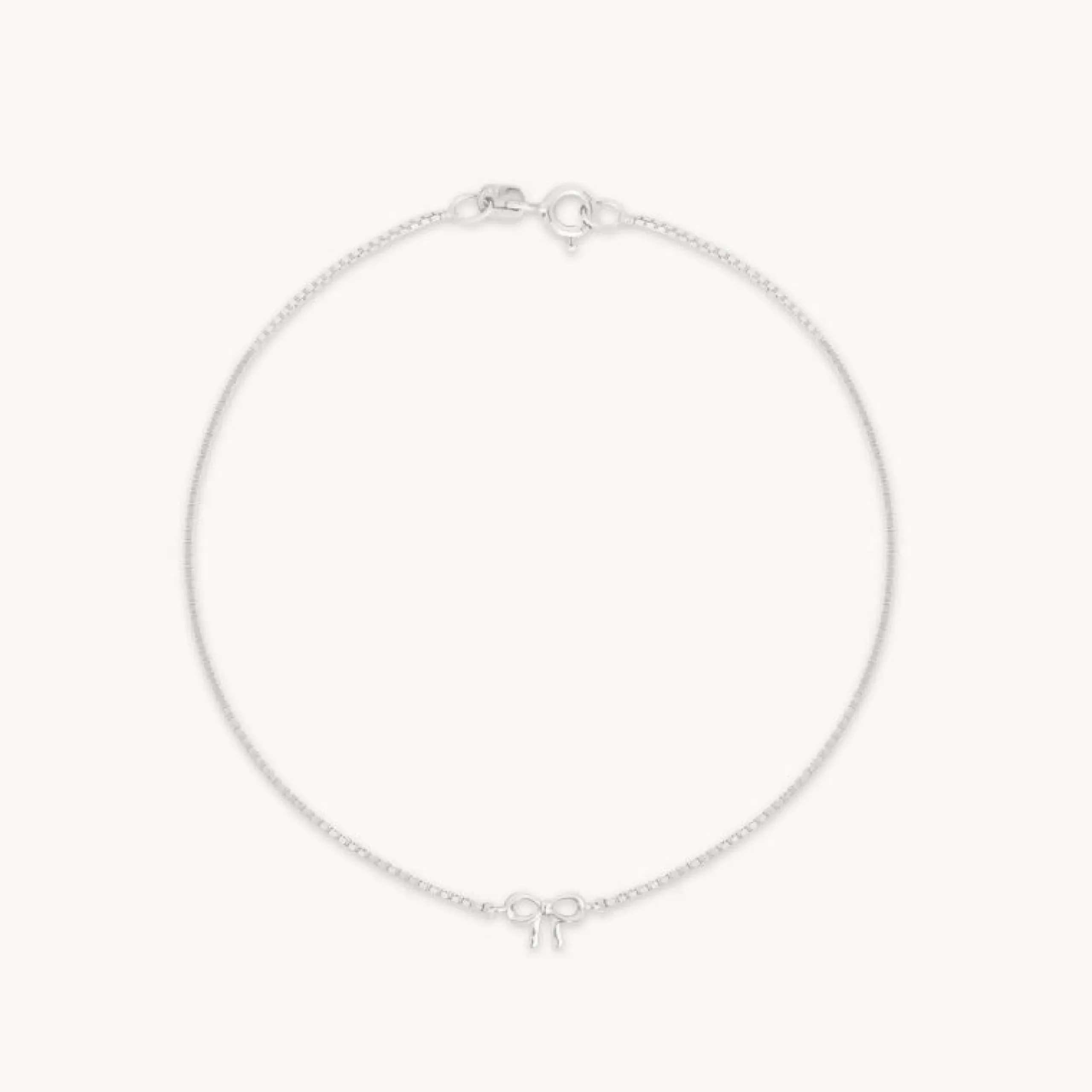bow_charm_bracelet_in_sol_0-1.webp Bow Charm Bracelet in Solid White Gold