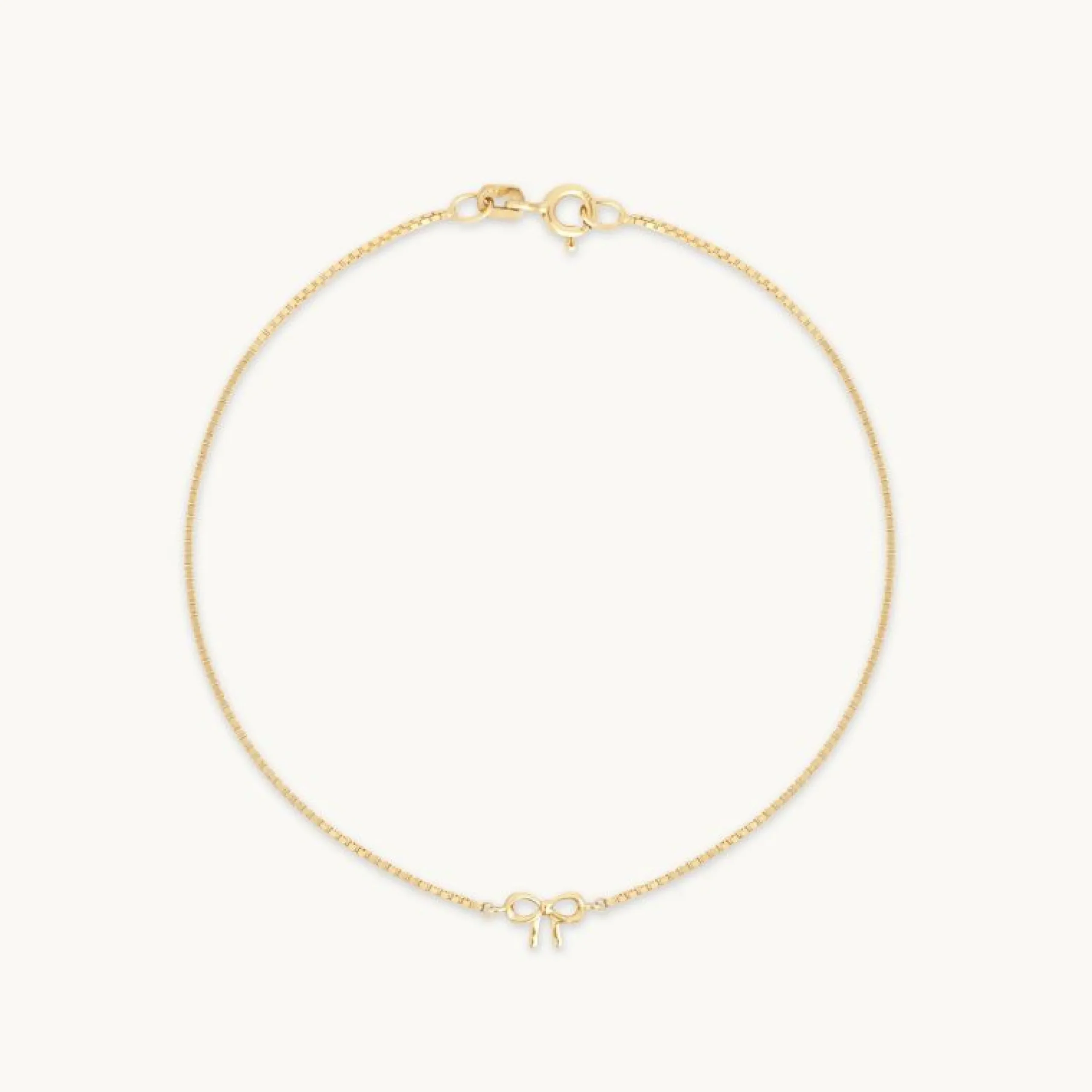 bow_charm_bracelet_in_sol_0.webp Bow Charm Bracelet in Solid Gold