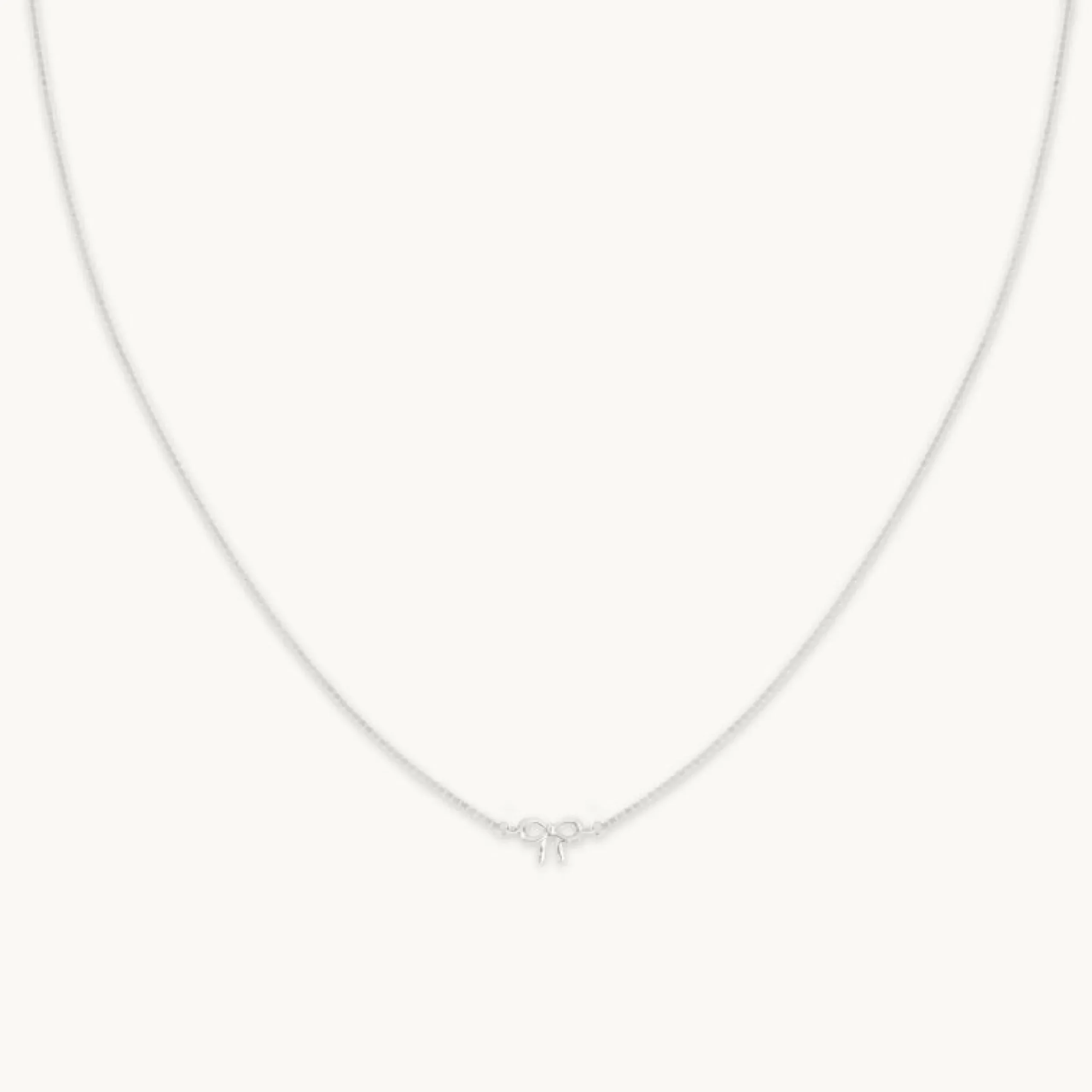 bow_charm_necklace_in_sol_0-1.webp Bow Charm Necklace in Solid White Gold