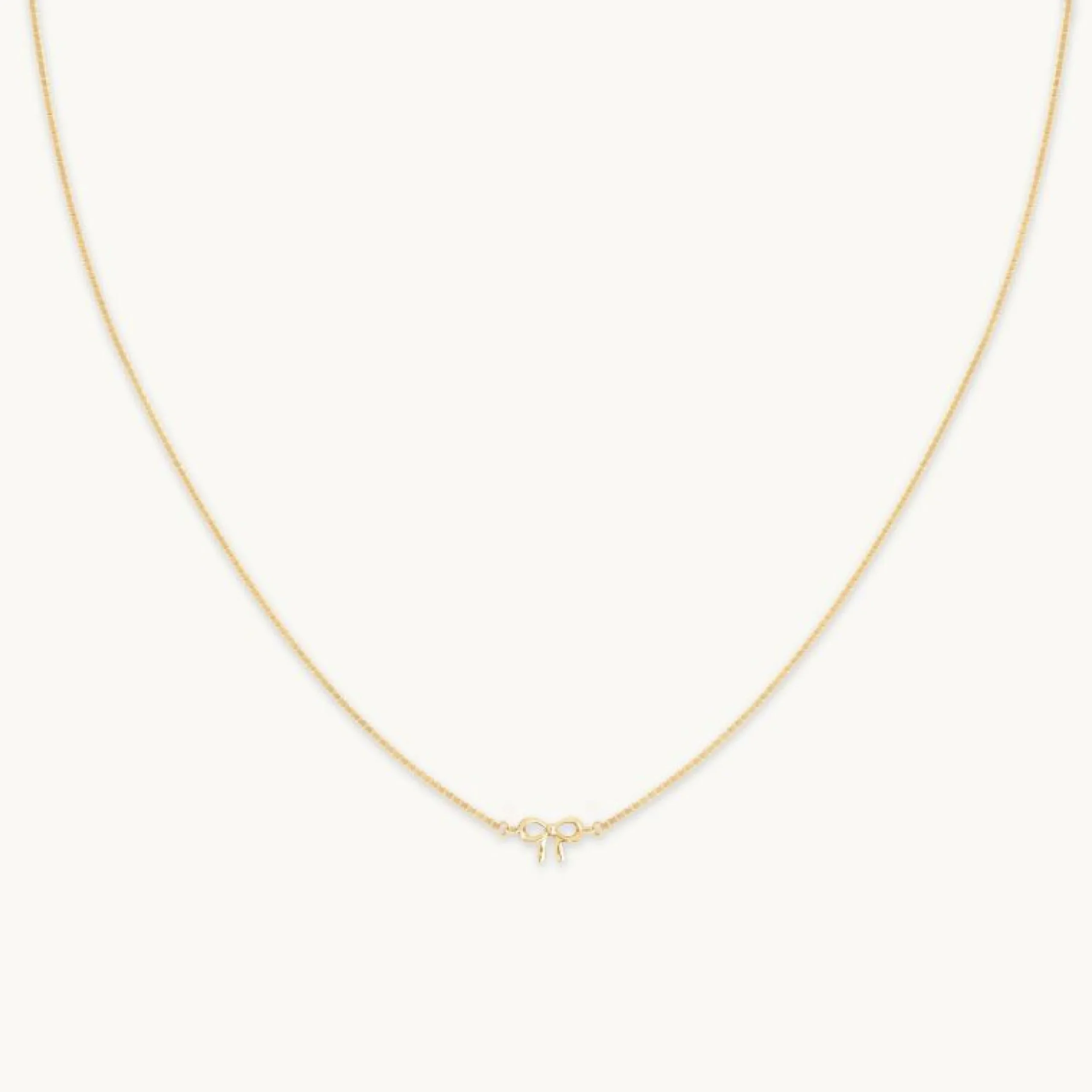 bow_charm_necklace_in_sol_0.webp Bow Charm Necklace in Solid Gold
