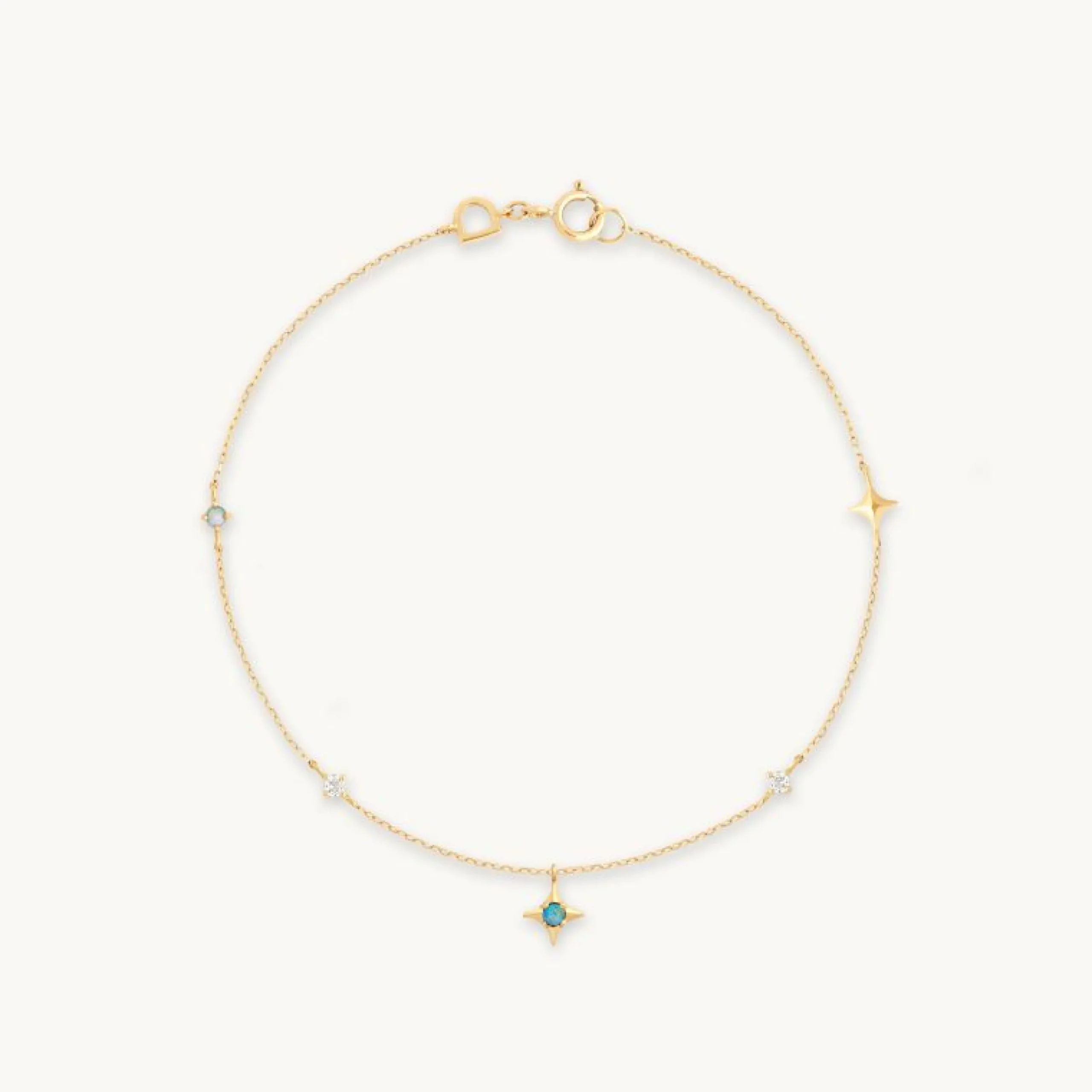 cosmic_star_opal_charm_br_0.webp Cosmic Star Opal Charm Bracelet in Solid Gold