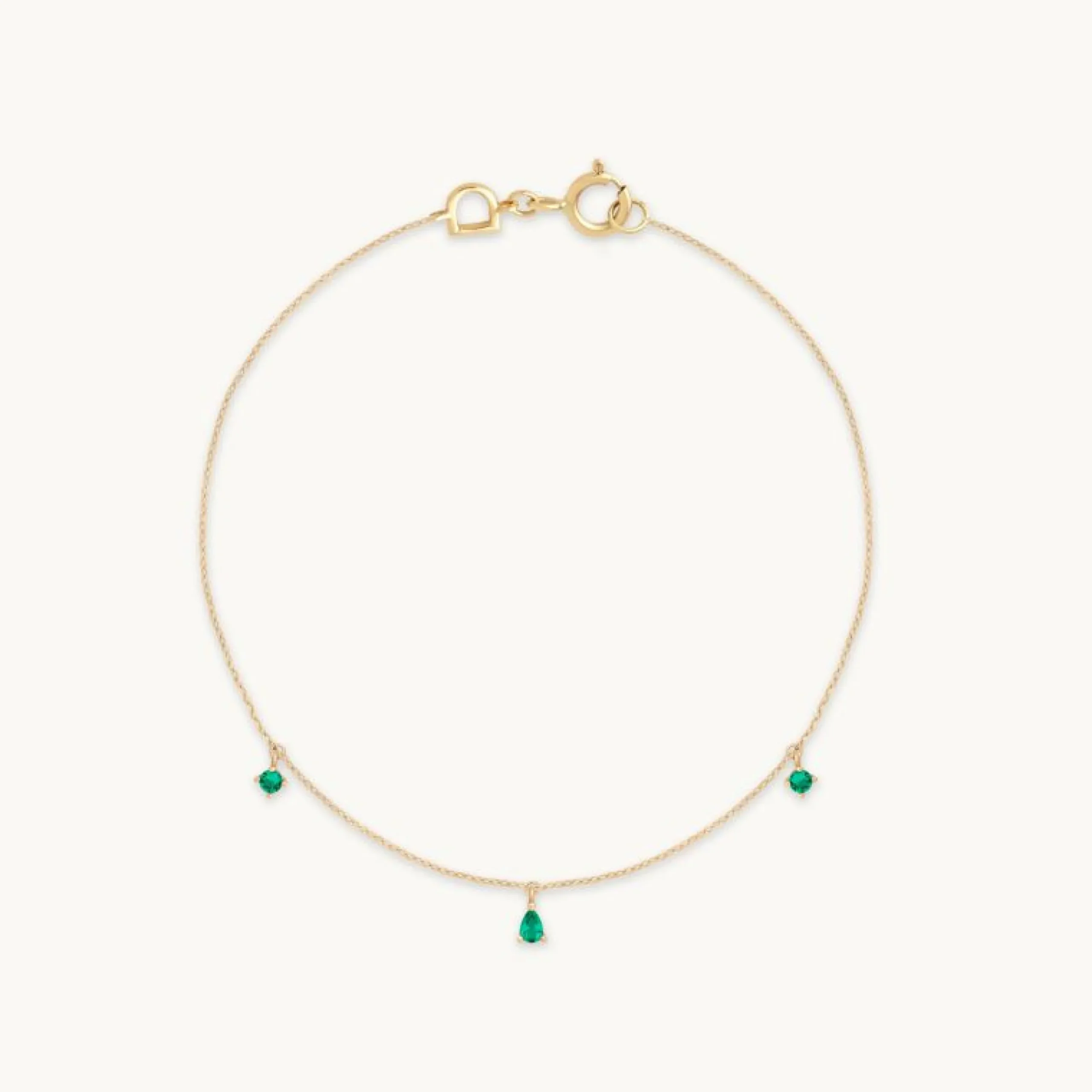 emerald_charm_bracelet_in_0.webp Emerald Charm Bracelet in Solid Gold