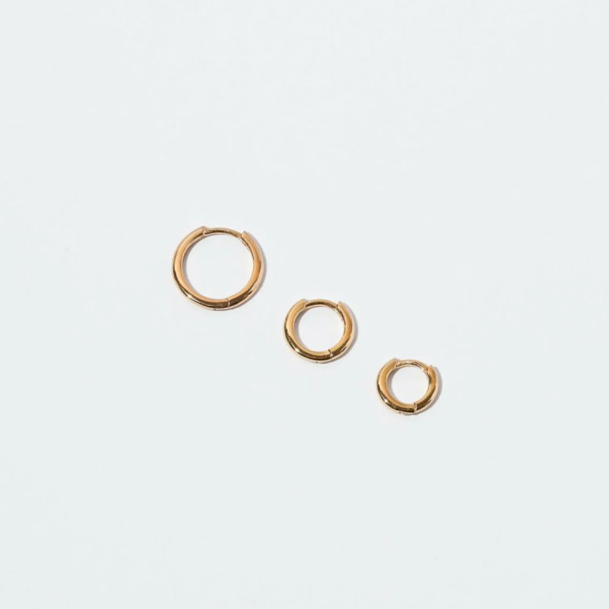 essential_mm_hoop_in_gold_4.webp Essential 11.5mm Hoop in Gold