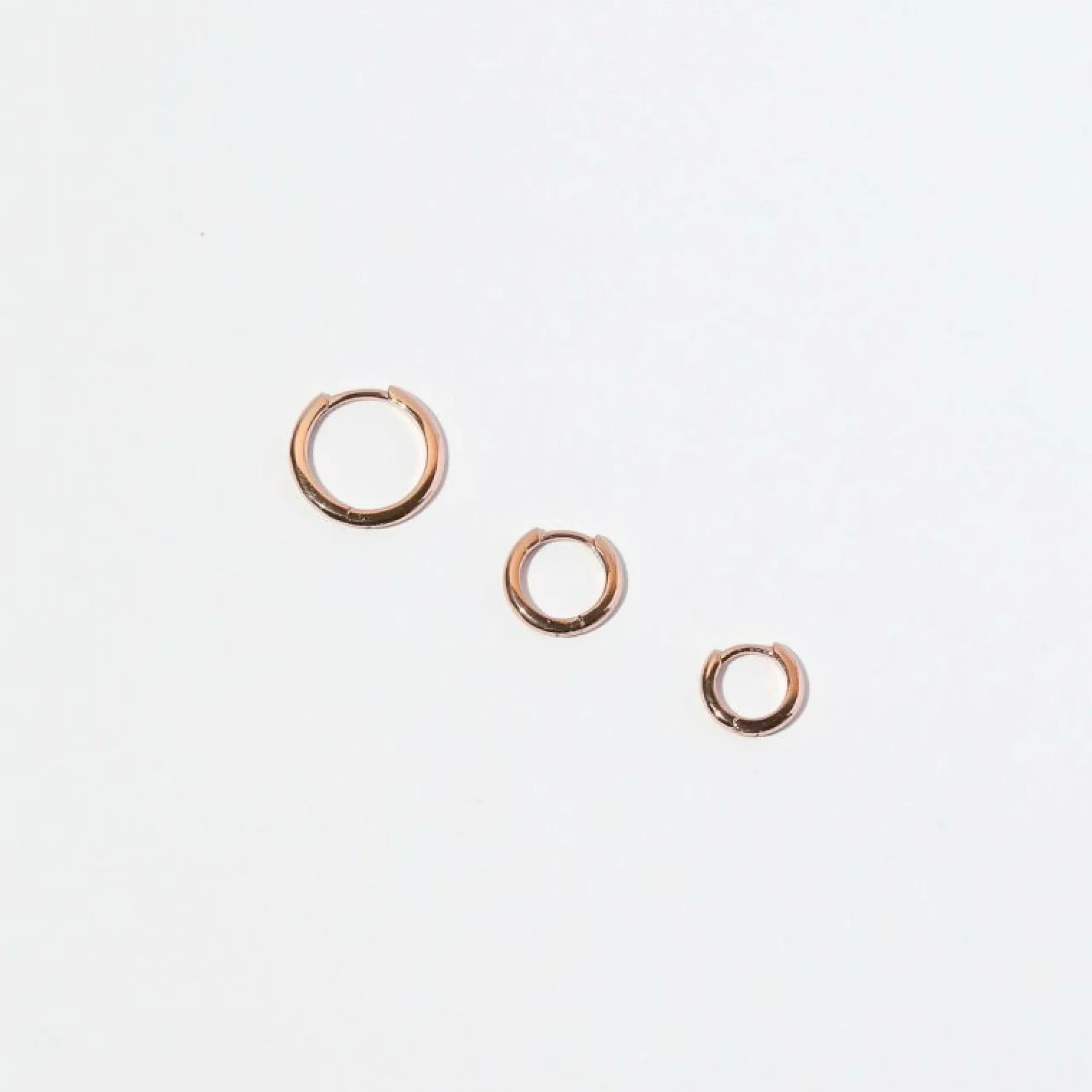 essential_mm_hoop_in_rose_5.webp Essential 8mm Hoop in Rose Gold