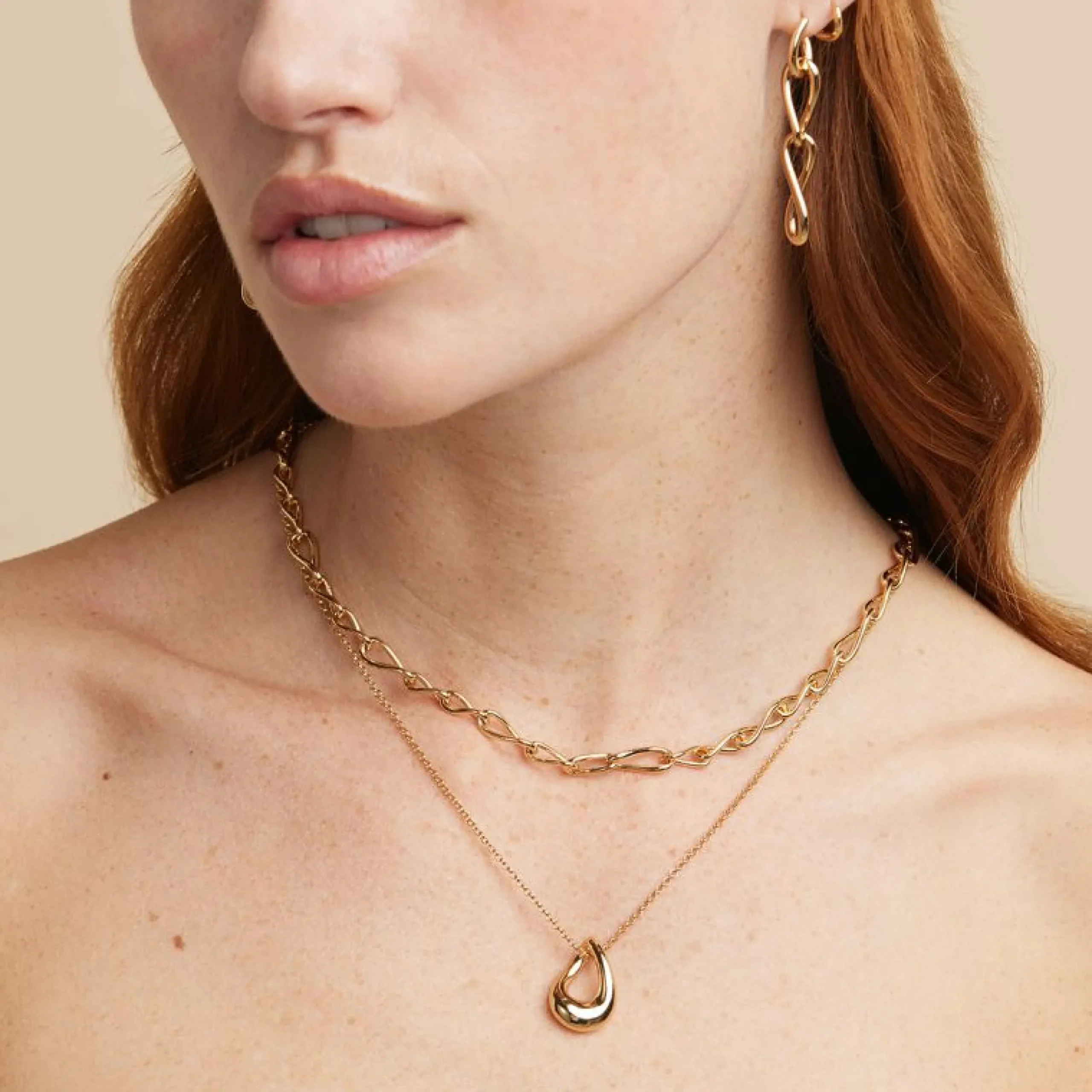infinite_drop_stud_earrin_4.webp Infinite Drop Stud Earrings in Gold
