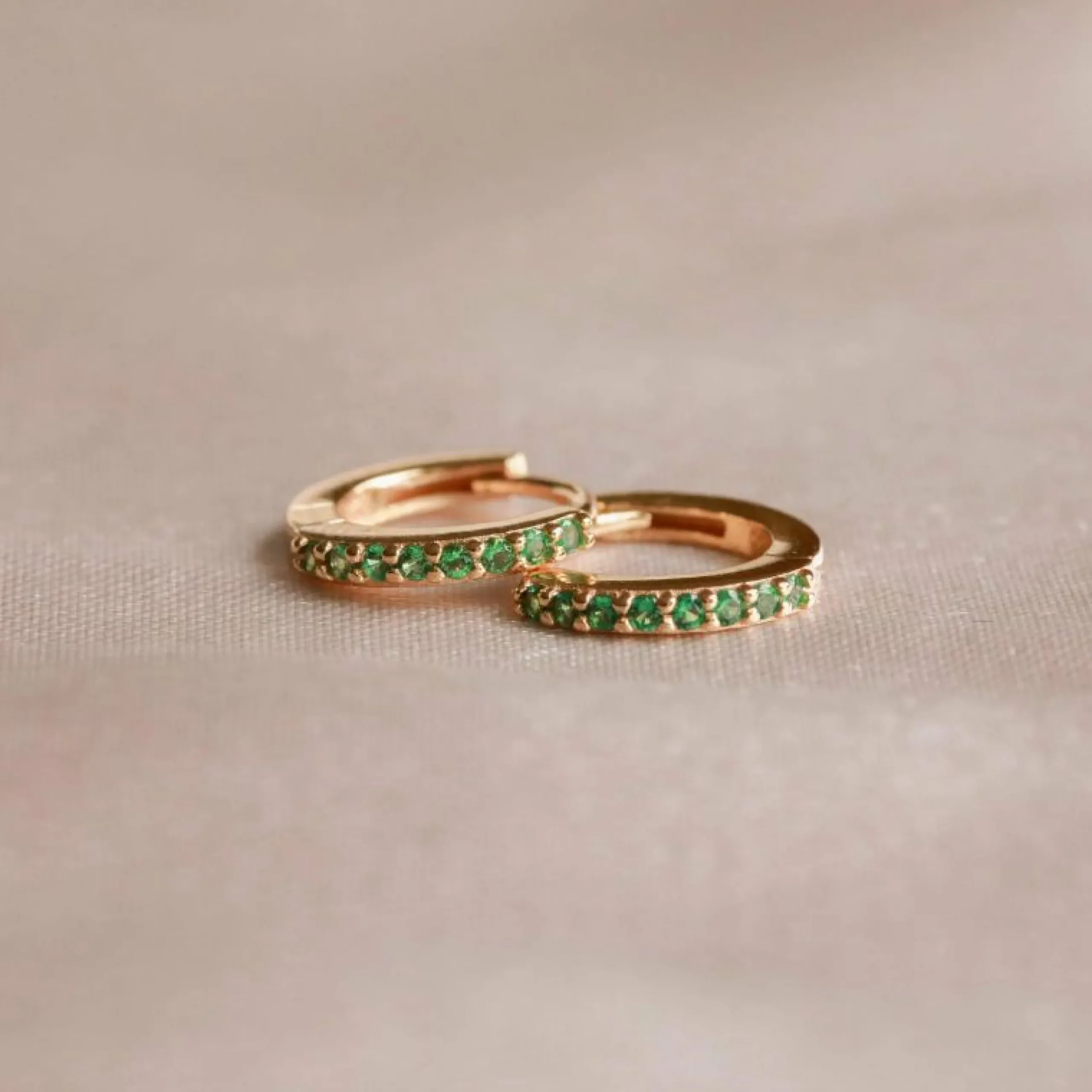 may_birthstone_huggies_in_2.webp May Birthstone Huggies in Gold with Emerald CZ