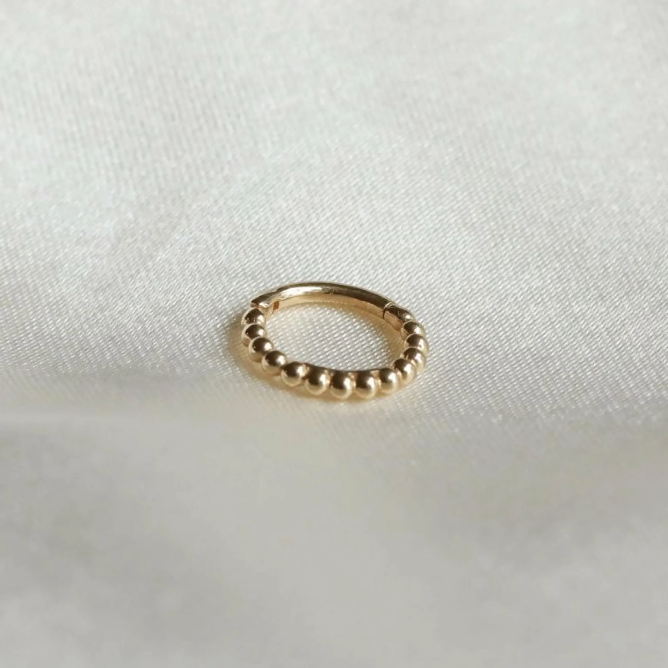 solid_gold_beaded_piercin_2.webp Solid Gold Beaded Piercing Hoop