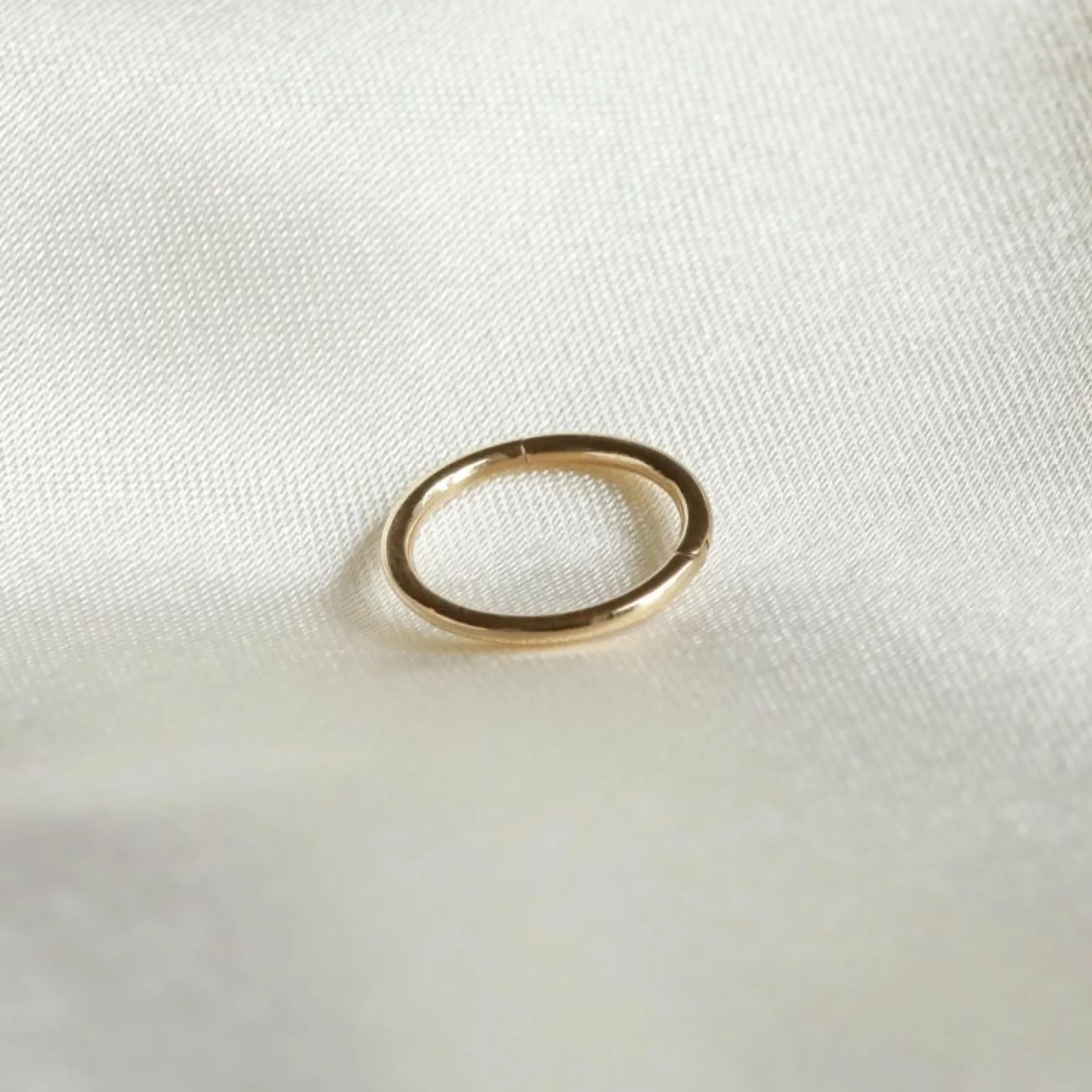solid_gold_simple_piercin_4.webp Solid Gold Simple Piercing Hoop