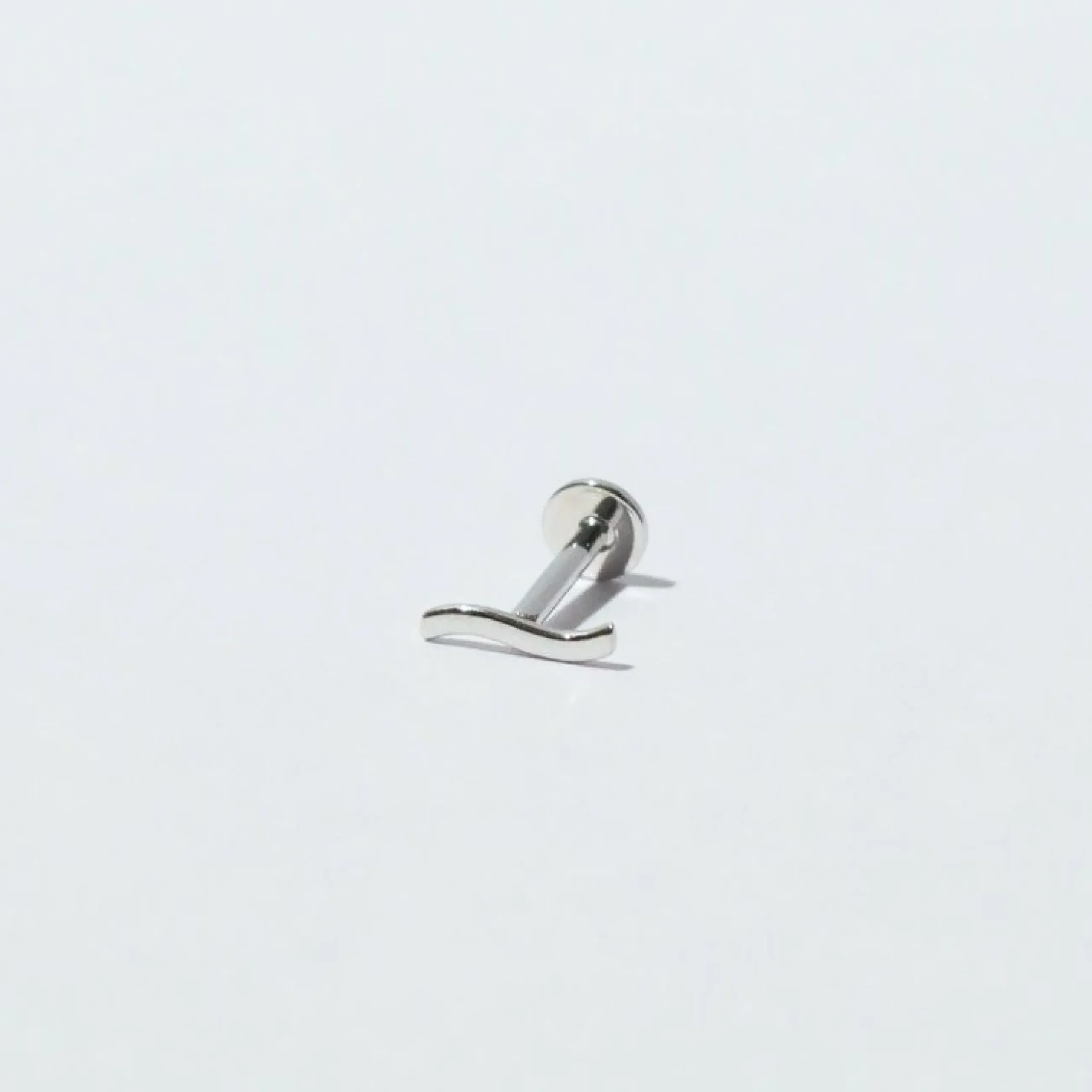 wave_piercing_stud_in_sol_2-1.webp Wave Piercing Stud in Solid White Gold