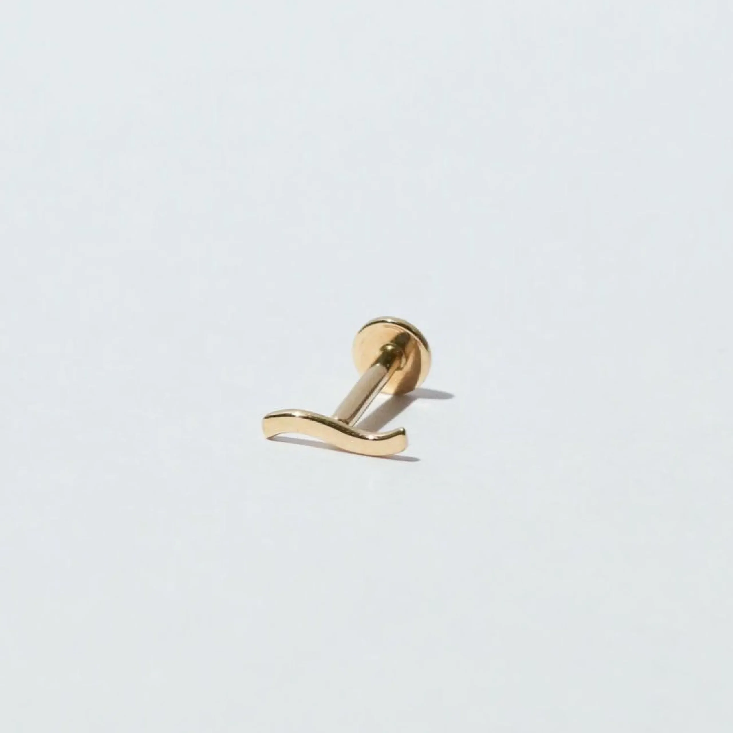 wave_piercing_stud_in_sol_2.webp Wave Piercing Stud in Solid Gold
