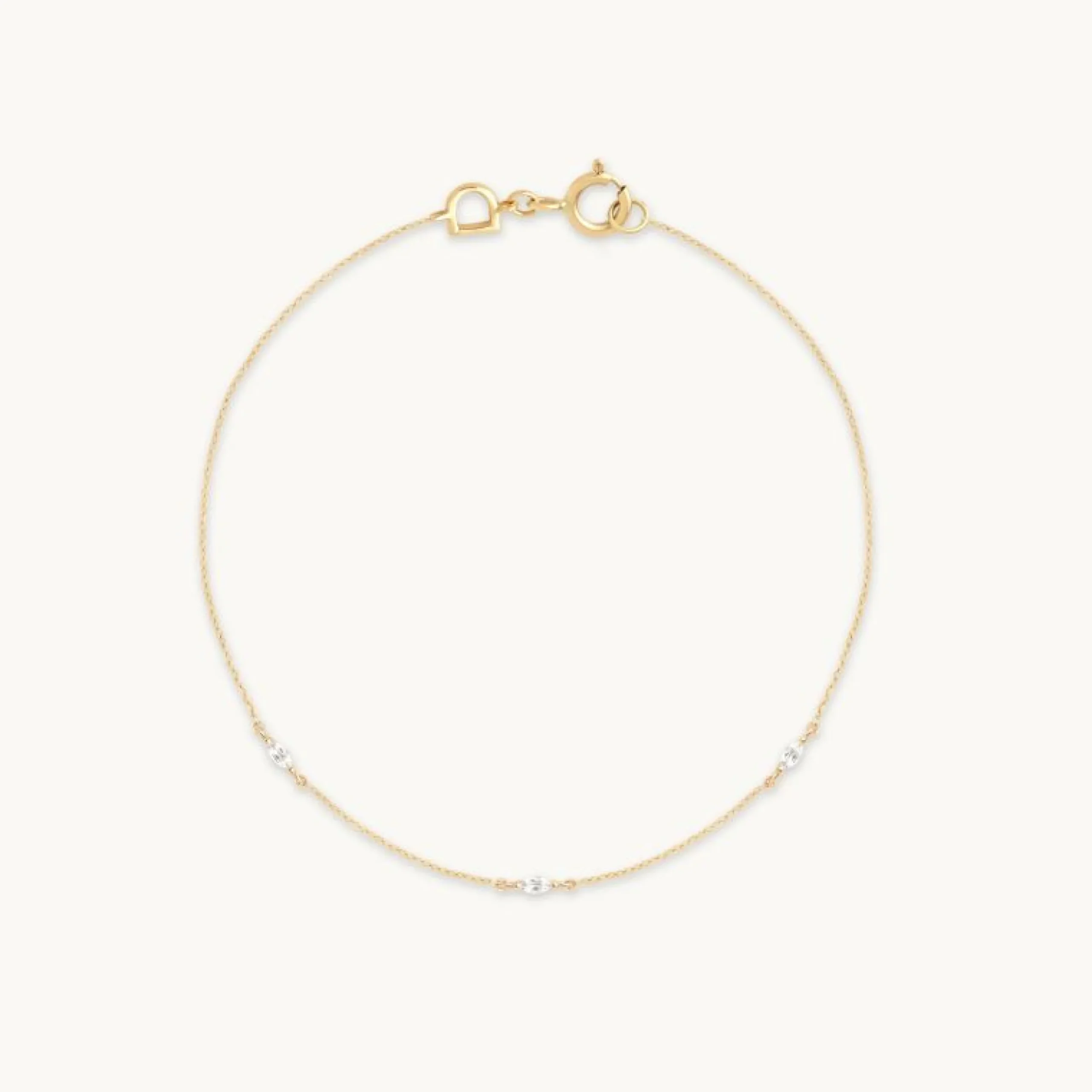 white_topaz_marquise_char_0.webp White Topaz Marquise Charm Bracelet in Solid Gold