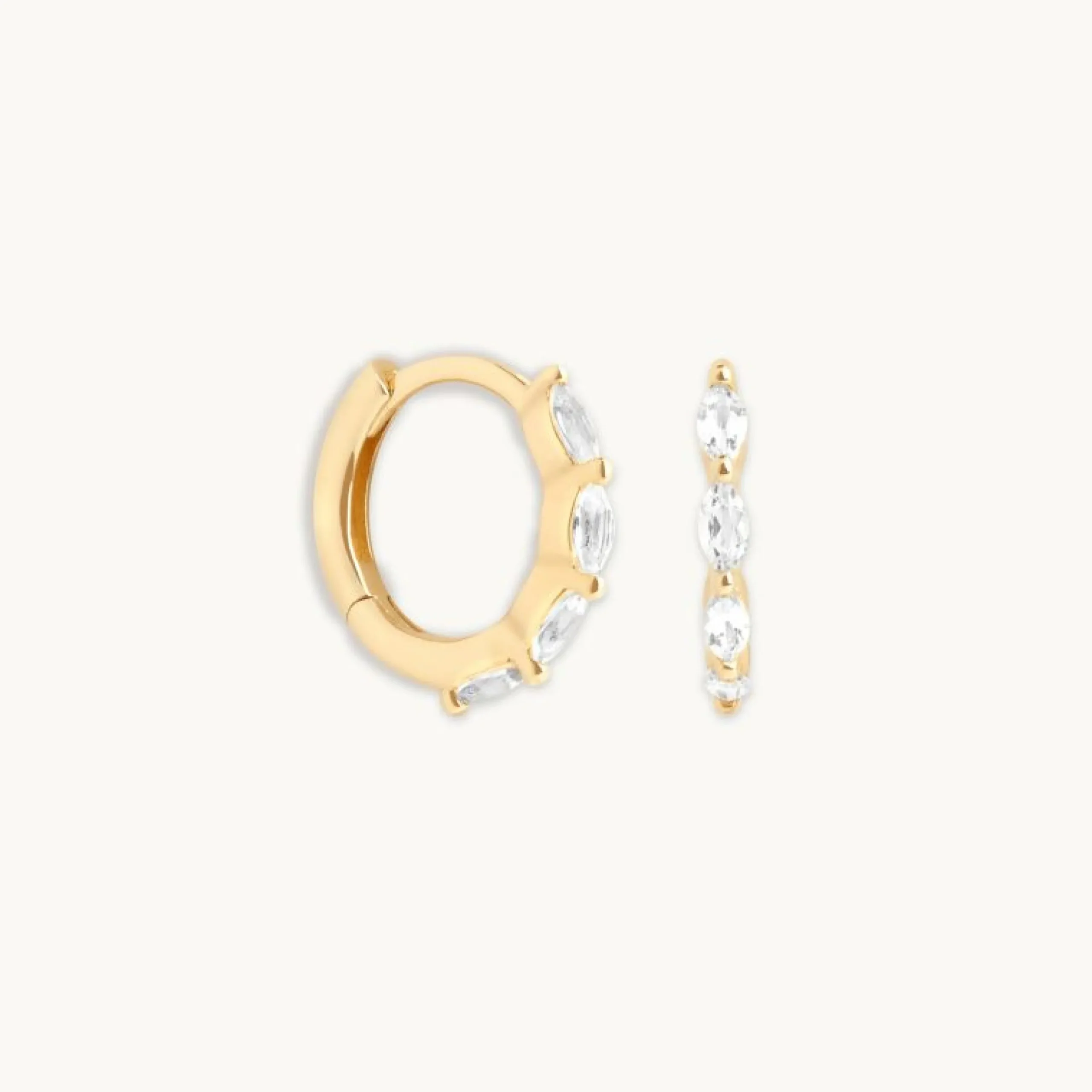 white_topaz_marquise_hugg_0.webp White Topaz Marquise Huggies in Solid Gold