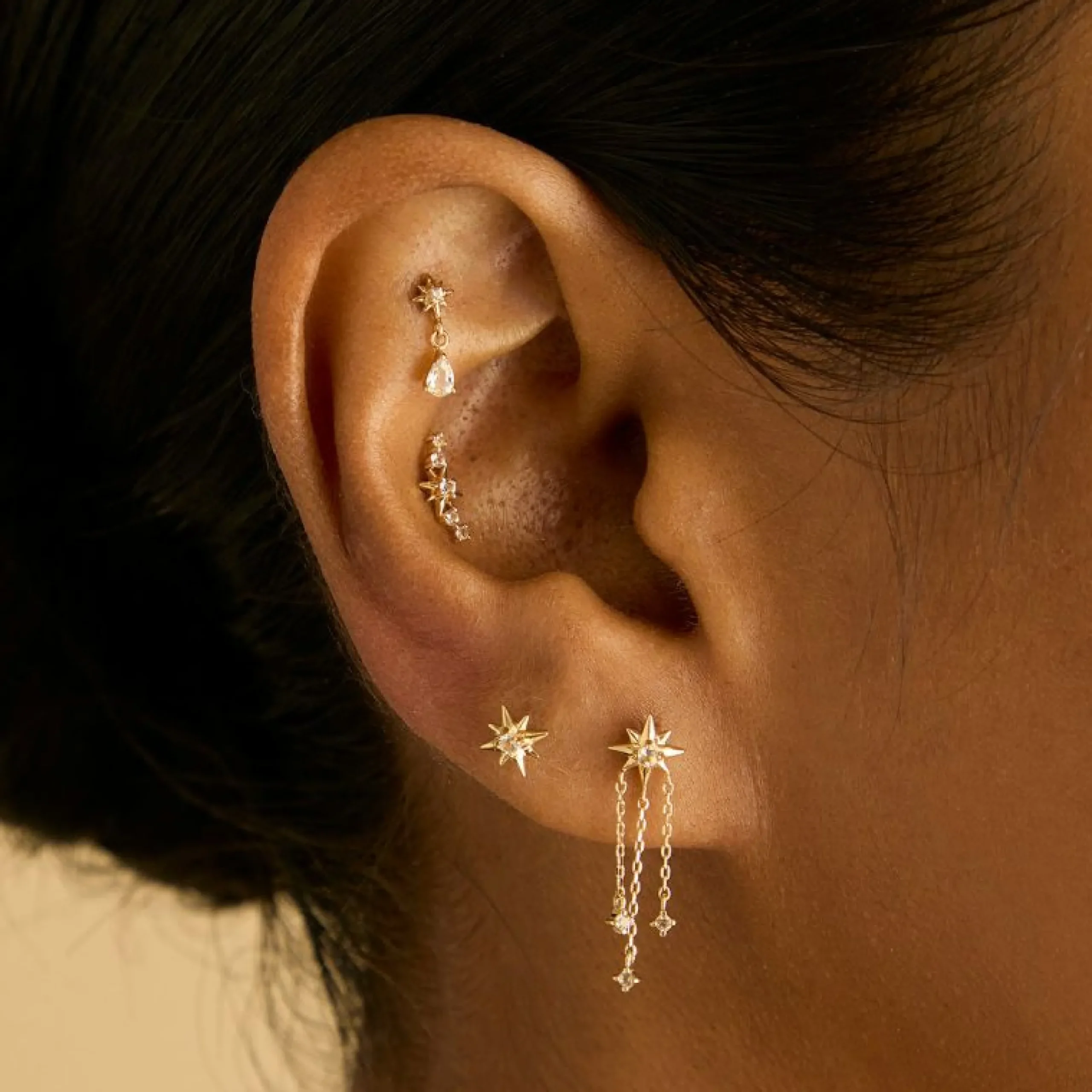 white_topaz_star_studs_in_2.webp White Topaz Star Studs in Solid Gold